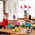 kids sitting around a colorful Christmas table setting